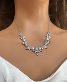 "Very romantic diamond bridal necklace set: necklace, bracelet and earrings.  Gorgeous bridal or bridesmaids jewelry set for a wedding day!   This wedding jewelry set is available in silver, gold or pink gold(rose gold) color to match your dress.   Necklace measures about 16\" long and 18\" with an extension attached. Earrings are about 2\" long and 1/4\" wide. Matching regular bracelet is measuring: 7\" long and 1/4\" wide or an adjustable bolo matching bracelet is available as well. High quali Dainty Crystal Necklaces For Wedding, White Cubic Zirconia Necklace For Bride, Elegant White Gold Bridal Necklace With Crystal, Elegant White Gold Crystal Bridal Necklace, Dainty Gold Rhinestone Necklace For Wedding, Delicate Cubic Zirconia Bridal Necklace For Wedding, Dainty Gold Rhinestone Wedding Necklace, Delicate Bridal Necklace With Cubic Zirconia, Delicate Cubic Zirconia Bridal Necklace