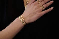 Unveil the timeless elegance of J.Tyler Jewelry's Forever Cuffs, handcrafted in 14-karat gold and tailored to your taste. Each cuff is available in yellow, white, or rose gold. These cuffs, weighing between 22.5 to 38.5 grams, offer both standard and bespoke sizes, ensuring a perfect fit for every wrist size from XS to L. Personalization is at the heart of our collection; adorn your cuff with a selection of precious stones - diamonds, black diamonds, rubies, emeralds, or sapphires, and add a nar Luxury Modern Gold-tone Cuff Bracelet, Luxury Gold Tarnish-resistant Cuff Bracelet, Luxury Gold-plated Yellow Gold Cuff Bracelet, Luxury Statement Gold-plated Cuff Bracelet, Luxury Gold-toned Sterling Silver Cuff Bracelet, Moon Collection, Gold Bracelet Cuff, Gold Cuffs, Pendant Earrings