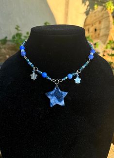 Blue starry necklace with blue and white star pendant made with polymer clay. Fits like a choker Blue Star Charm Necklace As Gift, Blue Star Charm Necklace As A Gift, Blue Jewelry With Star Charm For Jewelry Making, Blue Star Charm Jewelry As Gift, Handmade Blue Pendant Charm Necklace, Blue Necklace With Star Charm As A Gift, Handmade Adjustable Star Necklace, Trendy Handmade Star-shaped Necklace, Blue Star Charm Jewelry For Gift