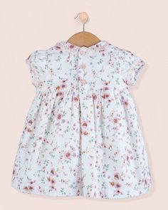 Our beautiful Bianca is hand smocked in a dressy flannel print. It features short puff sleeves and a Peter Pan collar trimmed with delicate lace. Fully lined with a button closure back. 100% Organic Cotton From France. Fully Lined in Cotton Delicate Machine Wash Cold, Flat Dry, Cool Iron, Dry Clean This dress runs lightly smaller, please size up for a better fit Smock Dresses With Flutter Sleeves For Daywear, Cute Smocked Short Sleeve Dresses, White Short Sleeve Dress With Smocked Back, Short Sleeve Printed Dresses For Daywear, Short Sleeve Printed Day Dresses, Printed Short Sleeve Day Dresses, Printed Short Sleeve Daywear Dresses, White Smock Dress With Flutter Sleeves, Cute Short Sleeve Dress With Smocked Back