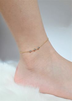 This beautiful handmade anklet features 3 Genuine Pyrite gemstones wrapped in the metal of your choice. Dainty, minimal, and elegant, this bracelet is the perfect finishing touch to any style or event. Makes a great gift to add to any gemstone lover's collection. Perfect to gift for Christmas, Valentine's Day, Mother's Day, and more! Gemstone: Silver Pyrite Gemstone Size: 3.0 mm Gemstone Shape: Rondelle, Faceted Metal: 14k Gold Filled or Sterling Silver (Nickel Free) Anklet Length: 9 inches (mod Minimalist Handmade Anklet As Gift, Dainty Handmade Anklets As Gift, Minimalist Handmade Anklet For Gift, Dainty Handmade Anklets For Gifts, Dainty Handmade Anklets For Gift, Handmade Minimalist Anklet For Gift, Handmade Dainty Anklets As Gift, Dainty Anklets With Adjustable Chain As Gift, Dainty Anklets With Adjustable Chain For Gift