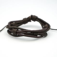 This twisted waxed leather cord bracelet is adjustable to fit most wrists. Available in brown or black. Size: 15mm wide. Casual Leather Bracelet With Adjustable Cord, Masculine Everyday Adjustable Bracelets, Adjustable Leather Strap Jewelry With Waxed Cord, Adjustable Waxed Leather Bracelet, Adjustable Rugged Leather Bracelet, Adjustable Braided Bracelets With Sliding Knot For Outdoor, Outdoor Adjustable Braided Bracelets With Sliding Knot, Adjustable Braided Bracelet With Sliding Knot For Outdoor, Casual Brown Bracelet With Adjustable Cord