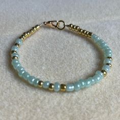 - One Of A Kind Beaded Charm Bracelet - Featuring Turquoise And Gold Seed Beads - Gold Colored Hardware - Clasps Closed. No Stretch. - Size/ Circumference Is 7” - Handmade (By Myself). Perfect To Treat Yourself Or To Give As A Unique Gift! **Add 2 Jewelry Items Marked “2 For $20” To Your Bundle And I Will Send You An Offer For $20** Check Out The “Boutique” Tab In My Closet For Handmade Earrings, Bracelets, And Necklaces! Charm Bracelets Diy, Gold Bead Bracelet, Beaded Charm Bracelet, Gold Beaded Bracelet, Bracelets To Make, Pearl Bracelets, Turquoise And Gold, Beads Bracelet Design, Silver Bead Bracelet