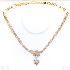 This exquisite 18k gold set, weighing 37.6 grams, features a stunning royal flower drop design adorned with dazzling diamonds. The yellow gold finish enhances its luxurious appeal, making it perfect for any special occasion. The set includes a necklace with a total diamond weight of 4.97 carats, featuring F-G color and VS quality diamonds in round and baguette shapes. The necklace has a length of 16.5 inches with a 1.4-inch drop length, adjustable 0.7-inch links, and a secure hook lock. The matc Gold Brilliant Cut Flower Jewelry, Gold Jewelry With Brilliant Cut Flower, Gold Flower-shaped Jewelry With Brilliant Cut, Gold Flower Pendant With Brilliant Cut, Formal Yellow Gold Flower-shaped Diamond Necklace, Formal Yellow Gold Diamond Necklace With Flower Shape, 22k Gold Jewelry With Flower Pendant For Wedding, Yellow Gold Diamond Flower Jewelry, Gold Brilliant Cut Flower Shape Necklace