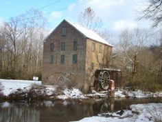 an old water mill in the middle of winter