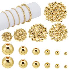 gold beading and accessories are shown on a white background