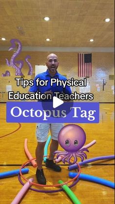 a man standing on top of a basketball court with an octopus tag in front of him