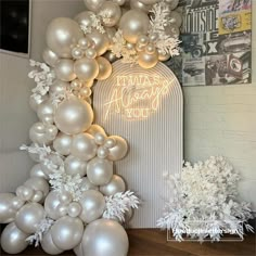 white balloons and snowflakes are on display in front of a sign that says, i was always you