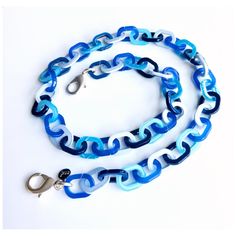 Eyeglass chain features colorful links in varying shades of blue. Available with matte silver or matte gold lobster clasps. Ultra lightweight, colorful and stylish! Choose your length from the drop down menu. Comes with one pair of rubber connectors (6 colors to choose from). Available with matte silver or matte gold lobster clasps, or no lobster clasps. If you would like your chain designed with only the rubber connectors attached (no lobster clasps), please make the appropriate selection from the drop down menu. Handmade Blue Glass Glasses Chains, Trendy Adjustable Blue Glasses Chain, Blue Summer Glasses Chains, Summer Blue Glasses Chain With Adjustable Feature, Blue Adjustable Chain Glasses Chains For Summer, Blue Adjustable Glasses Chain For Summer, Blue Chain Jewelry For Summer, Trendy Blue Glasses Chains As Fashion Accessory, Blue Glasses Chains For Beach Summer