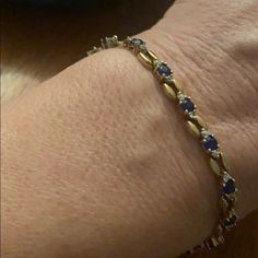 Sterling Silver Cz And Sapphire Stone Gold Plated Bracelet Very Good Condition Elegant Blue Bracelets With Sparkling Stones, Blue Bracelets With Diamond Accents For Gift, Elegant Blue Gold Bracelet For Formal Occasions, Elegant Blue Bangle Gold Bracelet, Elegant Oval Jeweled Bracelets, Blue Sparkling Stones Bracelet For Formal Occasions, Elegant Adjustable Blue Gold Bracelet, Elegant Blue Adjustable Gold Bracelet, Elegant Oval Jeweled Bracelet