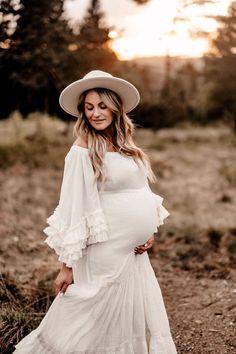 The ruffled sleeves on this boho dress add a playful and romantic touch to the overall look. We add lace details to create a more unique and intricate design. Versatile and fashionable choice that can be worn for a variety of photo shooting occasions. #centralcoastmaternityphotographer #lovephotography #californiamaternityphotographer #bohodress #centralcoastphotographer #maternityphotgraphy #sydneymaternityphotographer #sydneyphotographer #melbournematernityphotographer Spring Maternity Tiered Dress, Spring Maternity Wear Tiered Dress, White Summer Maternity Wedding Dress, White Maternity Wedding Dress For Summer, White Summer Maternity Dress For Wedding, White Maternity Dress For Summer Wedding, Summer Tiered Maternity Dress, Fitted Tiered Maternity Dress, Spring White Maternity Gown