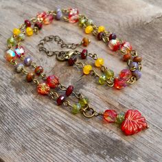 "This fun Boho-inspired necklace brings the warm colors of Autumn to any season. These gorgeous colors should not be limited to just one season a year. For those who look best in Fall and Spring colors, this necklace is for you! The slight differences in the leaf beads make this necklace a naturally unique feel. The larger leaf bead is 10 x 13mm; the smaller beads are 6mm and 3 x 5mm. All items in this series are shown in antique brass but can be made in gunmetal or silver. This necklace is 16 - Leaf Beads Necklace, Bohemian Jewelry Diy, Czech Beads Jewelry, Boho Necklaces, Autumn Jewelry, Colors Of Autumn, Leaf Beads, Autumn Necklace, Fairy Necklace