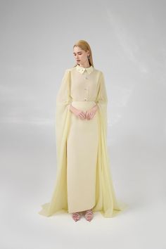 This chiffon set features a sheath silhouette and hanging sleeves, making it perfect for any formal occasion. The flowy, floor-length design is both elegant and comfortable, ensuring you look and feel your best all night long. The perfect combination of style and functionality. Length: 60cm (Front length of top), 107cm (Skirt) Georgette Maxi Dress With Cape Sleeves, Chiffon Gown With Cape Sleeves, Elegant Evening Dress With Sheer Cape Sleeves, Chiffon Maxi Dress With Cape Sleeves For Evening, Elegant Chiffon Gown With Cape Sleeves, Evening Cape Dresses In Georgette, Georgette Cape Evening Dress, Evening Georgette Dress With Cape, Elegant Sheer Chiffon Dress For Banquet