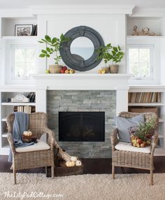 a living room with wicker chairs and a fire place in front of the fireplace