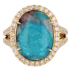 Feel inspired every time you slip on this 18kt Yellow Gold HH Collection Ring. Flaunting a gorgeous Oval Paraiba Tourmaline Cabochon, embraced in a sparkling halo of diamons, flowing along the split shank. An exquisite size 6.5 masterpiece, crafted with passion and brilliance. Dare to dazzle. Oval Paraiba Tourmaline Cabochon Diamond Yellow Gold Ring 18kt Yellow Gold 4.69ct Oval Cabochon Paraiba Tourmaline 0.55ct TW F/G VS1 Diamonds Diamonds:  around center stone and down the split shank Size 6.5 Vs1 Diamond, Paraiba Tourmaline, Split Shank, Yellow Gold Ring, Feel Inspired, Oval Cabochon, Yellow Gold Rings, Cocktail Rings, Gold Ring