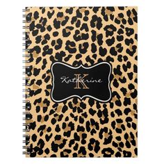 a leopard print notebook with the k logo on it