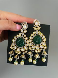 Sabyasachi inspired premium quality carved stone polki kundan earring in emerald green  and baby pink color. Inspire your style with this dual tone designer earring with premium polki kundan and american diamond with dome shaped small jhumkis. Adorn this classic and elegant jewelry for wedding, reception. cocktail or party.  Premium quality kundan is wrapped in pretty gold color with victorian finish American diamond details. Best quality of craftmanship.  All orders Ship same day if placed befo Elegant Green Kundan Chandbalis, Green Kundan Bridal Earrings With Cutdana, Green Kundan Chandbali Chandelier Earrings, Festive Green Kundan Chandelier Earrings, Green Kundan Chandelier Earrings For Festive Occasions, Green Stone Work Temple Jewelry Earrings, Heavy Green Kundan Chandbalis, Green Kundan Temple Jewelry Bridal Earrings, Elegant Green Kundan Chandelier Earrings