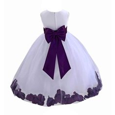 a white dress with purple flowers on the skirt