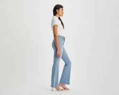 Our 726 High-Rise Flares are designed with a slim fit through your hip and thigh before flaring at the knee. Part of our signature ‘Lot 700’ fits, these jeans are designed to flatter;all day, every day. For those days when skinny jeans won't do Features a high rise Finished with a flared leg Authentic denim character enhanced with supersoft stretch. For jeans that'll leave you starry-eyed. That's Levi's® Stellar Stretch. Thanks to excellent built-in recovery, they champion your curves and move w Fitted Flare Jeans With Five Pockets, Fitted Full-length Medium Wash Flares, High Rise Medium Wash Fitted Flares, Medium Wash Fitted Mid-rise Flares, Fitted Mid-rise Denim Flares, Levi's High Rise Relaxed Fit Flare Jeans, Levi's High Rise Trendy Flare Jeans, Levi's Trendy High Rise Flare Jeans, Trendy High Rise Levi's Flare Jeans