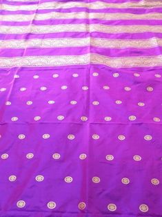 This Banarasi handloom pure silk lehenga is a perfect festive/wedding/occasional wear it enhanced with purple color motifs.  Occasion: party wear/wedding  Materials. Pure silk. Unstich  Fabric design - Banarasi shikargah lehenga  Pattern: paisley/buti motifs.  Borders: yes  Border type: Zari  Zari type: golden zari  Fabric length with blouse and with dupatta.  Borders is 6.5 meters  Blouse: 0.85 Meters  No of kali: 18 Size of kali 42 inch  No of border in dupatta 9 Purple Banarasi Silk Traditional Wear With Pallu, Purple Handloom Semi-stitched Traditional Wear, Purple Silk Traditional Wear With Cutdana, Purple Katan Silk Traditional Wear For Puja, Purple Banarasi Silk Traditional Wear For Puja, Traditional Wear With Zari Work In Purple For Festivals, Purple Katan Silk Traditional Wear For Diwali, Festive Purple Katan Silk Traditional Wear, Diwali Purple Katan Silk Traditional Wear