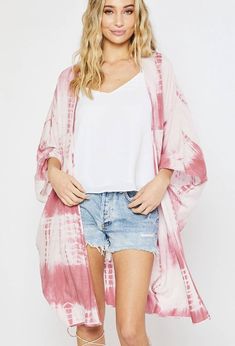 This beautiful shorter orange and pink tie-dye kimono is such a wonderful choice for summer and spring! This kimono looks fantastic with everything from dresses to jeans or over your swimsuit! We love throwing this kimono on over your favorite two-piece to head to the beach for sunrise! *The item is Pre-Ordered and expected to deliver mid-May!* 100% Polyester Hand wash cold / Dry Flat Patterns may vary Materials may have natural variations Colors may vary from different viewing devices. Oversized V-neck Spring Cover-up, Long Spring Loungewear Cover-up, Spring Flowy Wrap Cover-up, Flowy Spring Loungewear Cover-up, Oversized Spring Cover-up For A Day Out, Pink Kimono For Beach Cover-up, Spring V-neck Beachwear Kimono, Pink Kimono For Beach Cover-up During Beach Season, Casual Spring Cover-up With Kimono Sleeves