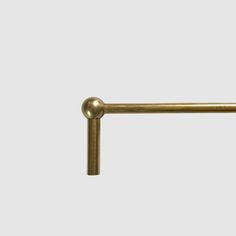 an antique brass pull handle on a white background