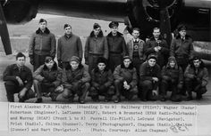 black and white photograph of men in front of an airplane with pilot's name on it