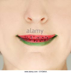 a woman's lips with watermelon painted on them