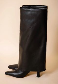 The NKC Store pointed toe classic black boot with fold over detail. Soft Vegan Leather, Heel Height: 3in, Shaft Height: 19in, Boot Opening: 15in Shaft Circumference: 14in. Shipping could take 7-14 days. fall winter boots, shoe obsession, pointed toe heeled boots, sustainable women's shoes, clothing, shopping, footwear, it girl, cool girl aesthetic Boots Folded Over, Fold Over Boots Outfit, 2025 Predictions, Foldover Boots, Classic Black Boots, Fall Winter Boots, Cool Girl Aesthetic, Fold Over Boots, Boots Shoe