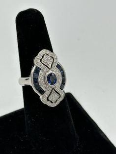 Levian 18K White Gold Blue Sapphire Diamond Ring Art Deco Style Sz 6  | eBay Art Deco Blue Diamond Ring With Center Stone, Art Deco Blue Sapphire Ring With Center Stone, Art Deco Blue Diamond Ring With Accents, Blue Art Deco Diamond Ring With Center Stone, Blue Art Deco Diamond Ring With Accents, Timeless Hallmarked Sapphire Ring, Elegant Multi-stone Sapphire Cluster Ring, Elegant Sapphire Multi-stone Cluster Ring, Blue Platinum Art Deco Diamond Ring