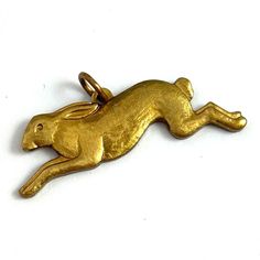 Rabbit Charm, Running Rabbit Charm, Brass Charm, Vintage Jewelry, Vintage Charm, Vintage Brass Charm, Animal Charm, Rabbit Jewelry by eVintique on Etsy Running Rabbit, Rabbit Jewelry, Custom Charm Bracelet, Morristown Nj, Bunny Necklace, Rabbit Charm, Rabbit Pendant, Custom Charms, Gold Charm Bracelet