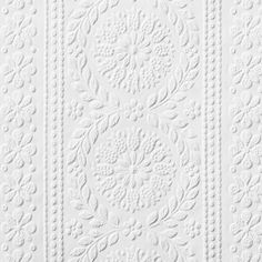 a white wallpaper with an intricate design on it's side and the top half of