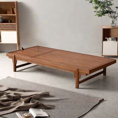 a wooden table sitting on top of a carpeted floor