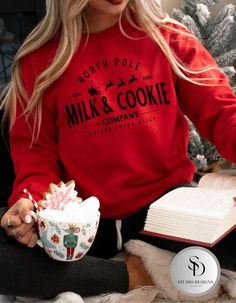 Snuggle up this holiday season with the cozy and festive Milk and Cookie Company crewneck sweatshirt. Featuring a vintage-inspired design, this sweatshirt is perfect for spreading Christmas cheer and enjoying the warmth of the season. Made from a soft, high-quality Gildan fabric, this crewneck offers both comfort and style, whether you're lounging by the fireplace or baking cookies. Ideal for gifting or adding to your holiday wardrobe, this sweatshirt brings a touch of nostalgia with its charming design. Material: Gildan cotton blend for ultimate comfort Fit: Unisex sizing, relaxed fit for a cozy feel Design: Milk & Cookie Company  Occasions: Perfect for casual outings, baking cookies, or as a thoughtful Christmas gift Gift Ideas: Ideal for baking cookies, casual outings, or those looking Christmas Clothes Women, Christmas Sweatshirts Vinyl, Casual Christmas Outfits, Christmas Sweatshirt Ideas, Vintage Christmas Shirt, Christmas Crewneck Sweatshirt, Cookie Company, Cricut Christmas, Christmas Outfits Women