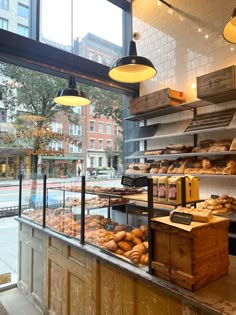 a bakery filled with lots of bread and pastries