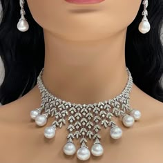 A timeless classic, the Beauvince Diamond & Pearl Vines Necklace is a fine balance of elegance and flamboyance. Gemstones Type: Pearl Gemstone Origin: South Sea Gemstones Shape: Drop Shape Gemstones Weight: 136.80 ctGemstones Color: White Diamonds Shape: Round Total Diamonds Weight: 19.26 ctDiamonds Color: H - I Diamonds Clarity: VS - SI (Very Slightly Included - Slightly Included) Metal: 18K White Gold Metal Wt: 78.93 gms Setting: Prong & Pave Set Length: 15 Inches Price Quoted may be negotiabl South Sea Pearl Necklace, Pakistani Bridal Jewelry, Beef Empanadas, Fine Pearl Jewelry, Earrings Diamonds, Big Necklace, Art Jewelry Design, Pearl And Diamond Necklace, Diamond Necklace Designs