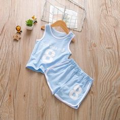 2-piece Letter Pattern Vest & Shorts for Children Boy - PrettyKid Playful Stretch Summer Sets, Playful Stretchable Summer Sets, Blue Cotton Short Set For Playwear, Light Blue Cotton Sets For Summer, Sleeveless Cotton Short Set For Spring, Blue Sleeveless Summer Set, Blue Cotton Sets For Spring, Playful Summer Sets With Letter Print, Blue Stretch Cotton Sets