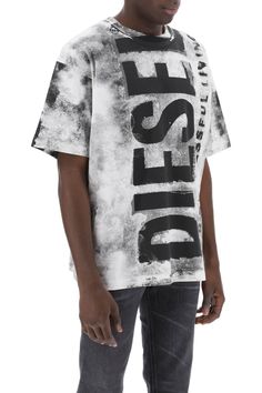 Diesel cotton jersey T-shirt featuring an oversized logo printed at front and back on a shaded background. It is cut for a loose fit and finished with a ribbed crew neck. The model is 187 cm tall and wears a size L. Composition: 100% CO | Diesel Men's Printed T-shirt With Oversized Logo in Very Black | SS24 Shaded Background, Diesel Black Gold, Harris Wharf London, Heron Preston, Moon Boots, Norma Kamali, See By Chloe, Jersey T Shirt, The Model