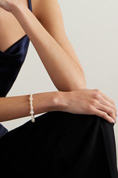 Mizuki's bracelet harnesses the timeless elegance of pearls in a completely modern way. It's crafted from 14-karat gold and strung with the lustrous gem in an array of sizes for added drama. Team yours with the coordinating necklace for a cohesive look. Delicate Formal Pearl Bracelet, Formal Pearl Bracelet With Pearl Charm, Delicate Pearl Drop Bracelet For Formal Occasions, Pearl Bracelet With Pearl Charm For Formal Occasions, Elegant Pearl Drop Bracelet, Elegant Pearl Bracelet With Pearl Chain, Elegant Adjustable Bracelet With Pearl Drop, Formal Delicate Pearl Bracelets, Elegant Formal Pearl Chain Bracelet