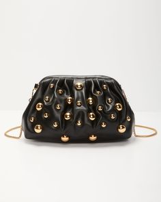 Unleash your inner star with the Make A Scene Studded Pouch Clutch. Crafted from luxe vegan leather, this clutch is your ultimate date night companion, blending edgy cool with a dash of romance. Its hinge closure reveals a chic interior with a main compartment and a secure zipper pocket, perfect for keeping essentials close. Adorned with gold-tone ball accents and a detachable chainlink shoulder strap, it’s designed to catch eyes and turn heads. FINAL SALE Material: Vegan Leather Hinge closure One main compartment with interior zipper pocket Chainlink shoulder strap Gold-tone ball accents throughout Dimensions: 9.6” L x 3.1” W x 5.7” H Trendy Clutch Pouch With Detachable Strap, Chic Party Pouch With Removable Pouch, Modern Clutch Shoulder Bag For Night Out, Party Clutch With Zipper Closure, Chic Pouch With Gold-tone Hardware, Chic Pouch Clutch With Zipper Closure, Party Crossbody Clutch With Removable Pouch, Leather Clutch With Chain Strap For Night Out, Trendy Black Pouch For Evening