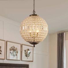 a chandelier hanging from the ceiling in a bedroom