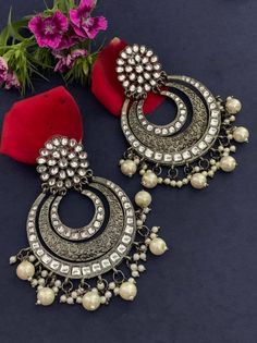 Step out in style with this beautiful oxidised silver plated earrings, which have been given a drop designer dangler perfectly designed. It will add bling to your look. This earring will go well with any of your ethnic outfits. Metal Chandbali Chandelier Earrings With Intricate Design, Metal Chandbali Bridal Earrings, Metal Chandbali Chandelier Earrings With Latkans, Metal Chandbali Danglers With Intricate Design, Metal Chandbali Chandelier Earrings, Intricate Metal Chandbalis Drop Earrings, Intricate Design Metal Chandbalis Drop Earrings, Heavy Chandbali Chandelier Earrings In Metal, Metal Chandbalis With Intricate Design