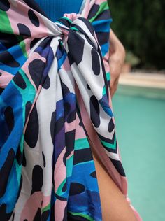 Meet the Melanie Pareo, your go-to layer for beach days and poolside lounging. Generously sized and crafted from soft, breathable rayon, it’s easy to tie and re-tie as you move from sun to shade. Wear it as a sarong skirt, knot it as a chic cover-up, or wrap it around your waist—this versatile pareo is designed for wherever the day takes you. Finished with tassel trim for a touch of movement, it’s a must-have for every woman who’s in and out of the water and always on the go.Pairs perfectly with Printed Summer Poolside Cover-up, Summer Tied Swimwear For Beach Party, Summer Tropical Print Poolside Cover-up, Summer Beach Swimwear With Tied Details, Summer Tied Swimwear For Pool, Beach Swimwear With Tied Details, Summer Tied Swimwear For Beach Season, Beach Season Tied Swimwear For Vacation, Tied Swimwear For Vacation And Beach Season