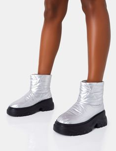 Be the envy of the lodge in these Frostbite Metallic Silver Nylon Quilted Chunky Sole Ankle Boots – they'll keep your feet toasty even in the coldest of climates. Chunky soles give you a daring step. and quilted nylon adds a touch of sass. Get rugged. stay warm! HEEL HEIGHT: 2.5" APPROX FABRIC COMPOSITION: SYNTHETIC MANMADE Ankle Boots Uk, Grab Bags, Platform Boots, Stay Warm, Faux Suede, Metallic Silver, Heel Height, Ankle Boots, Composition