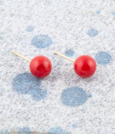 Get ready to add a pop of color to your look with these exquisite Dot of Red Coral Stud Earrings! Handcrafted and finished with care, these earrings feature genuine red coral spheres measuring .3" in diameter and are mounted on gold-plated brass posts. Perfect for any occasion, these earrings weigh in at just 2 grams. Embrace the beauty and uniqueness of these one-of-a-kind earrings today! Description: Coral is not a stone but an organic material formed by living organisms, specifically coral polyps. It's most commonly found in shades of red, pink, white, and black. Coral grows in branches that mimic underwater tree-like structures and is harvested from the ocean depths, primarily in the Mediterranean Sea and the Pacific Ocean. It's popular in jewelry for its vibrant colors and is often ca Red Hypoallergenic Round Bead Earrings, Coral Polyps, Living Organisms, Ocean Depth, Black Coral, Evil Spirits, Mediterranean Sea, Coral Reef, Red Coral