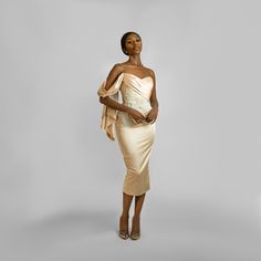 This Lovely draped off-the-shoulder dress comes with a sweetheart neckline, pleated panel at chest going down to the waist, then joined by beautiful hand beaded embroidery around the waist area. The White details on this piece are a combination of Pearls and sequins fixed by hand to perfection. With a Midi penciled silhouette, you’ve got room to show off your pretty shoes. Pair this dress with a single strap high heeled sandals and you are good to go. Dry Cleaning Only Off-shoulder Pre-draped Wedding Dress, Elegant Off-shoulder Sleeveless Dress With Fitted Bodice, Elegant Off-shoulder Corset Dress For Formal Events, Elegant Sleeveless Off-shoulder Dress With Fitted Bodice, Elegant Sleeveless Off Shoulder Dress With Fitted Bodice, Elegant Off-shoulder Dress With Ruched Bodice For Parties, Elegant Off Shoulder Dress With Fitted Bodice For Gala, Cocktail Dress With Straight Neckline And Pre-draped Style, Gala Evening Dress With Boned Bodice And Straight Neckline