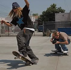 two skateboarders are doing tricks on their boards