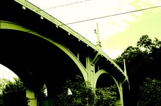 an image of a bridge that is going over the water with power lines above it