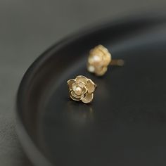 Why We Made This Our Dainty Jasmine Flower Stud Earrings, exquisitely designed to capture the delicate beauty of jasmine blossoms, are a perfect blend of romance and elegance. The delicate design and symbolic meaning of jasmine blossoms make these earrings a thoughtful and stylish addition to any jewelry collection. Whether worn daily or on special occasions, they beautifully convey love, sensuality, and grace. Product Details MADE FROM 925 Sterling Silver with 18K gold coating, Freshwater Pearl Dainty Flower Charm Earrings For Anniversary, Gold Petal Flower Earrings For Gifts, Dainty Flower Earrings For Anniversary, Delicate Flower Earrings For Anniversary, Elegant Sterling Silver Jewelry With 3d Flowers, Feminine Gold Petal Earrings, Elegant Yellow Gold Flower Pendant Earrings, Delicate Pearl Earrings With Elegant Design, Delicate Flower Earrings As A Gift For Her