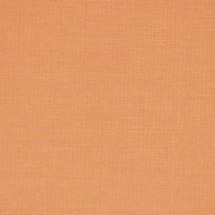 an orange fabric textured with small squares